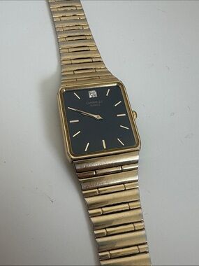 Men’s Caravelle Diamond Vintage Gold-Tone Square Tank Watch with Black Dial
